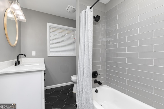 full bathroom with tile patterned floors, vanity, toilet, and shower / bath combo