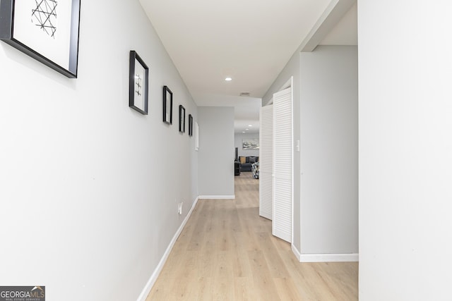 hall with light wood-type flooring