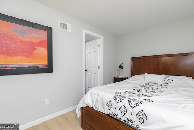 bedroom with light hardwood / wood-style floors