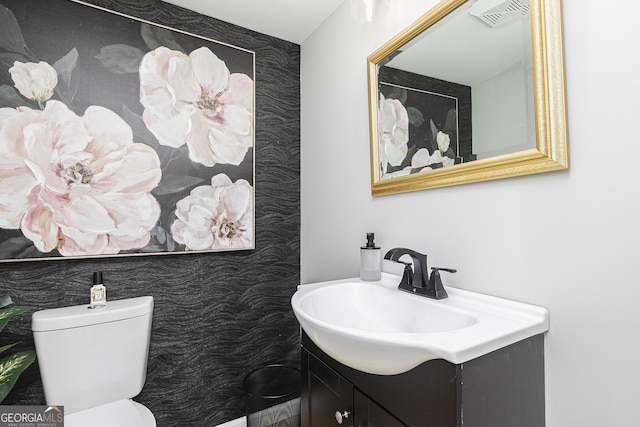 bathroom with vanity and toilet