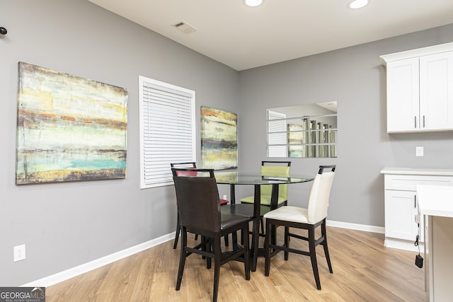 dining space featuring light wood-type flooring