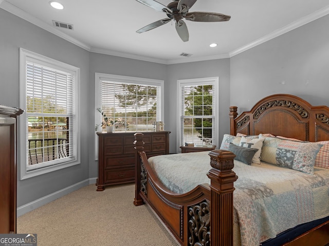 carpeted bedroom with ceiling fan, crown molding, and multiple windows