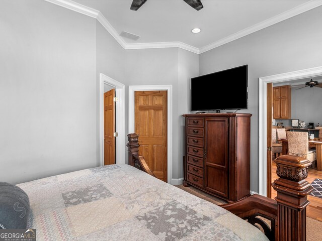 carpeted bedroom featuring ceiling fan and ornamental molding