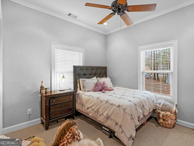 bedroom with ceiling fan, carpet, and ornamental molding