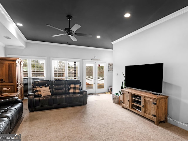 living room featuring ceiling fan, ornamental molding, light carpet, and french doors