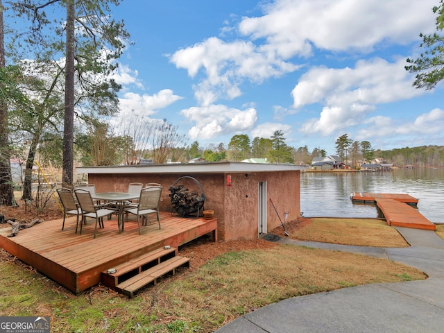 deck featuring a water view and a boat dock