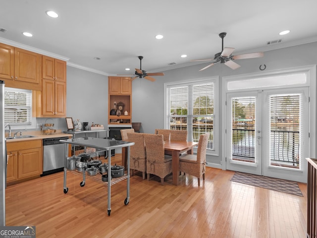 kitchen with light hardwood / wood-style floors, dishwasher, crown molding, and french doors