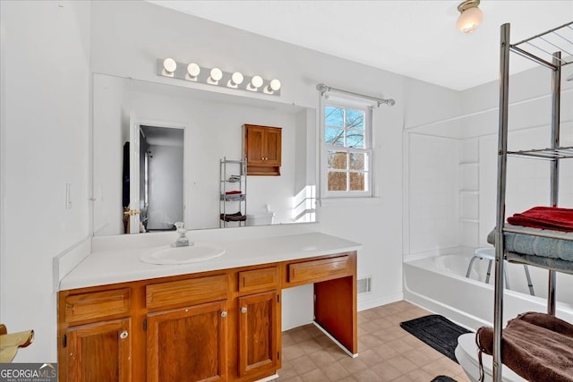 bathroom with shower / bathing tub combination and vanity