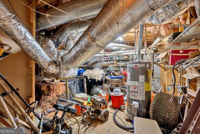 unfinished attic featuring gas water heater