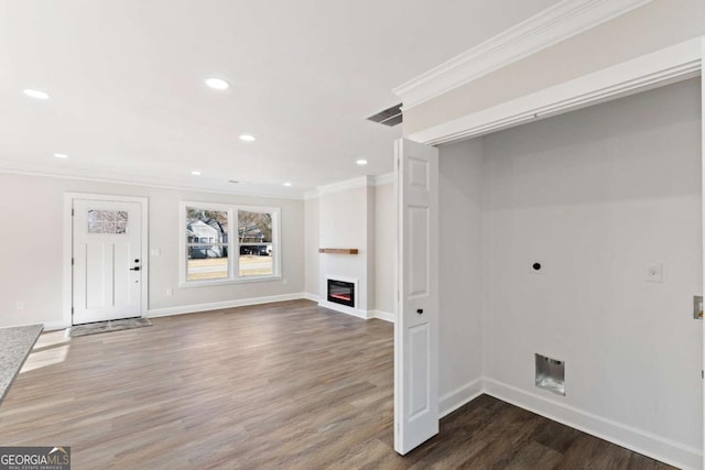 interior space with hardwood / wood-style floors and crown molding