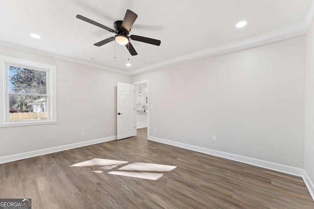 unfurnished bedroom featuring crown molding, dark wood-type flooring, and ceiling fan