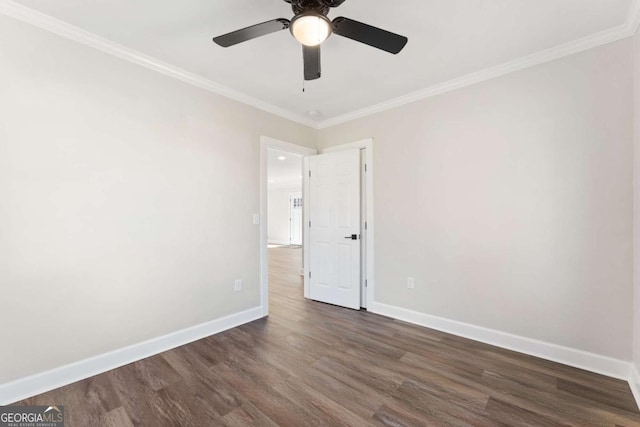 unfurnished room featuring crown molding, dark hardwood / wood-style floors, and ceiling fan