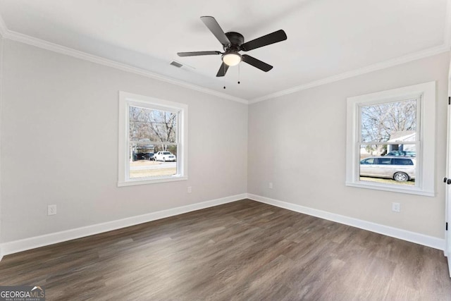 spare room with ornamental molding, ceiling fan, and dark hardwood / wood-style flooring