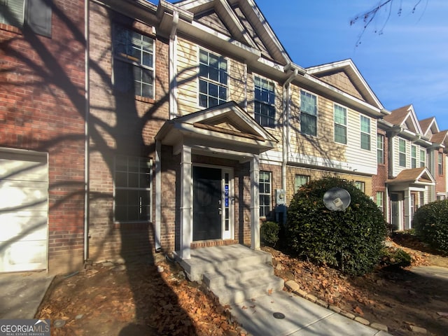 view of exterior entry featuring a garage