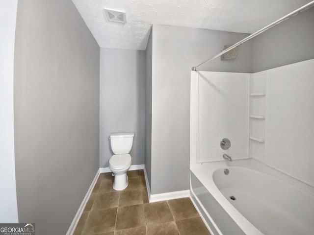 bathroom with shower / bathing tub combination, a textured ceiling, and toilet