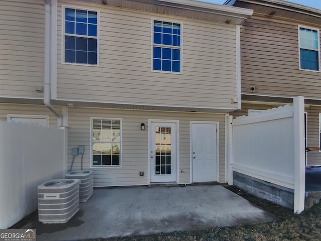 back of property with a patio area and cooling unit