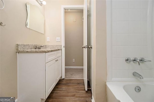 bathroom featuring vanity, shower / bath combination, and hardwood / wood-style flooring