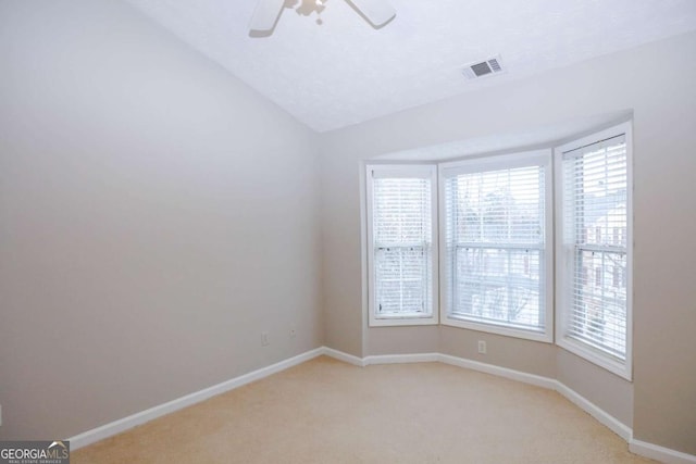 unfurnished room featuring ceiling fan and light colored carpet