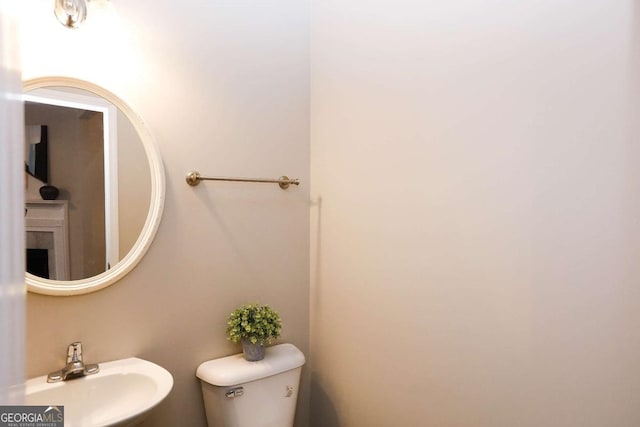 bathroom with toilet and sink