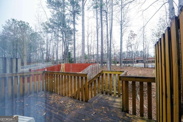 wooden terrace with a water view