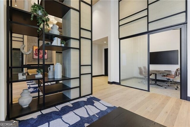 laundry room with cabinets, light tile patterned floors, washing machine and clothes dryer, and sink