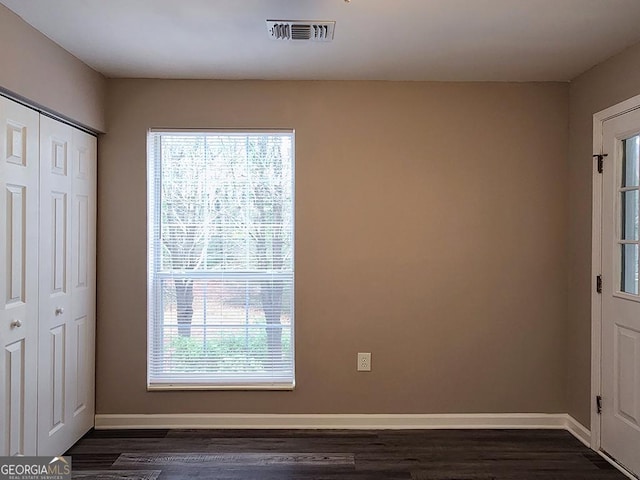 interior space with dark hardwood / wood-style flooring