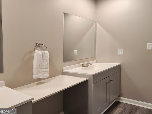 bathroom featuring hardwood / wood-style flooring and vanity