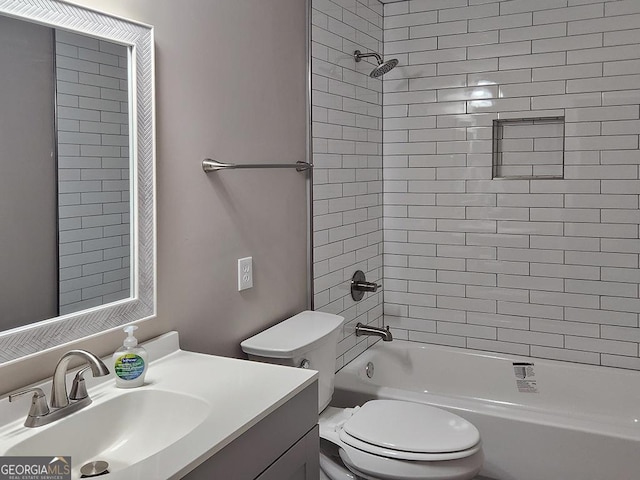 full bathroom with tiled shower / bath combo, vanity, and toilet