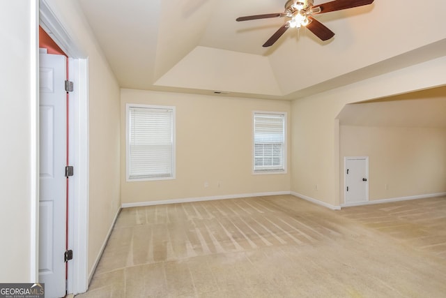 bonus room with light carpet and ceiling fan