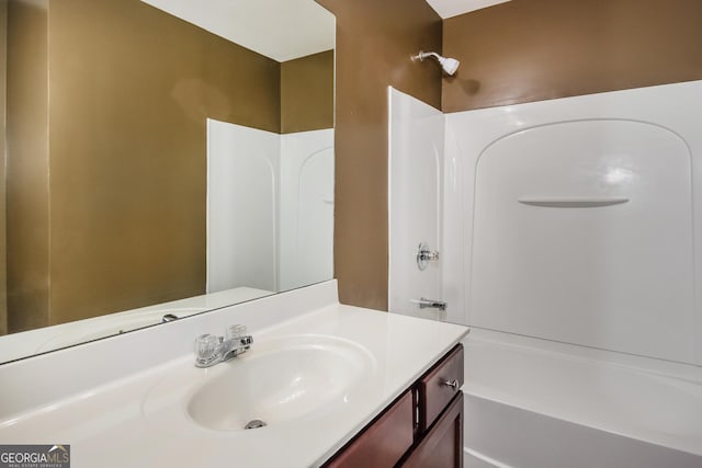 bathroom featuring shower / bathtub combination and vanity