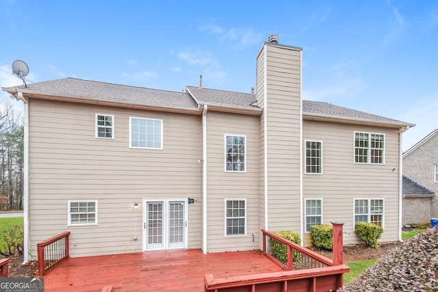 rear view of property with a wooden deck