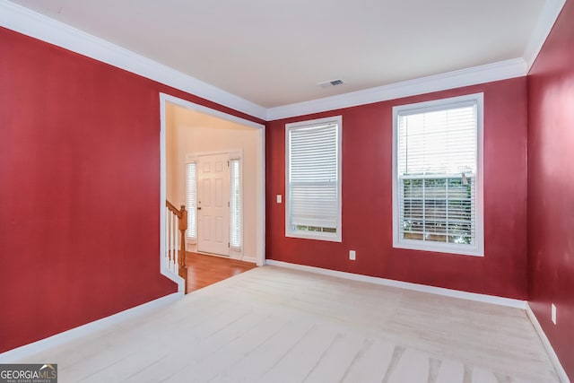 foyer featuring crown molding