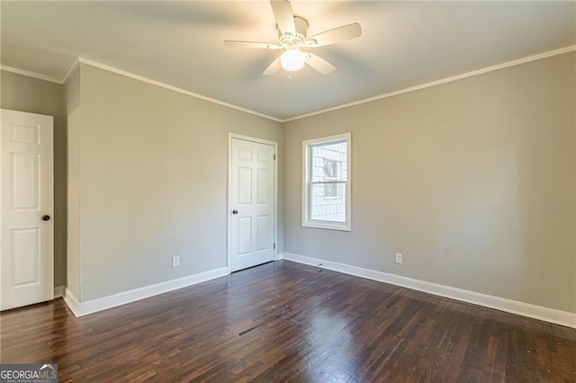 spare room featuring ceiling fan, ornamental molding, and dark hardwood / wood-style flooring