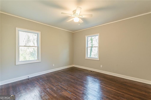 empty room featuring ornamental molding, dark hardwood / wood-style floors, and ceiling fan