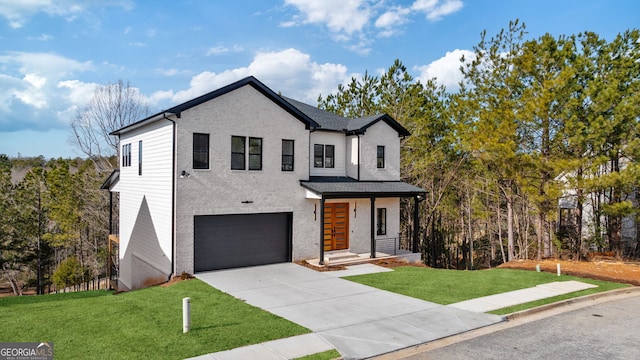 view of front of house with a garage and a front yard