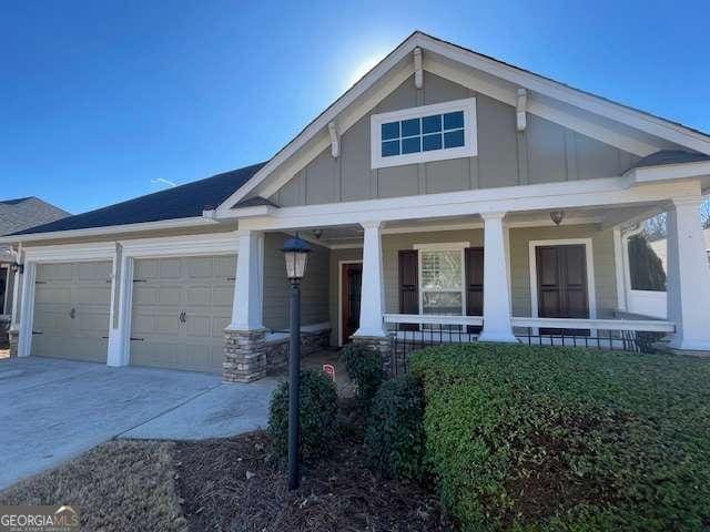 craftsman house featuring a garage and a porch