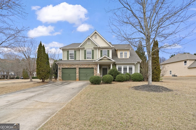 view of front of house featuring a garage and a front yard