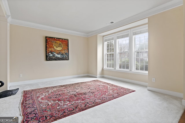 sitting room with crown molding and light colored carpet