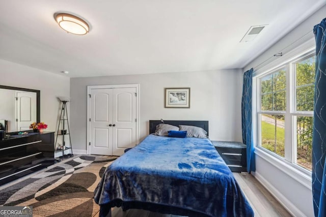 bedroom featuring wood-type flooring