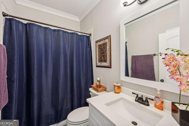 bathroom with toilet, crown molding, walk in shower, and vanity