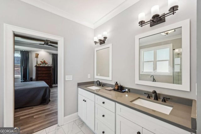 bathroom featuring vanity, a wealth of natural light, and ornamental molding