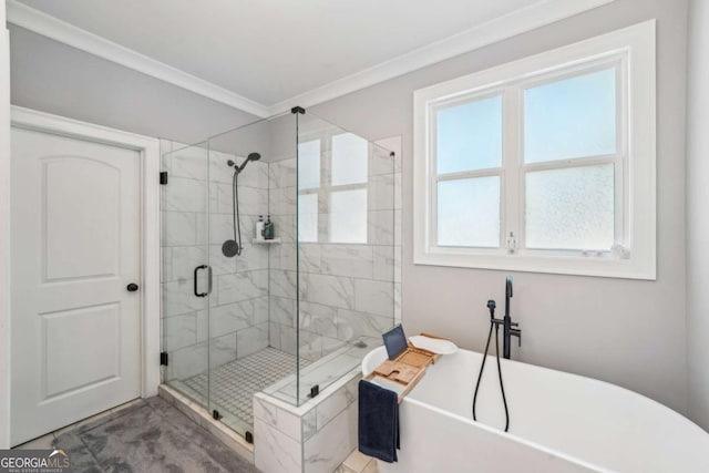 bathroom featuring a wealth of natural light, ornamental molding, and independent shower and bath