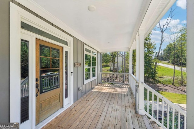 wooden terrace with a porch