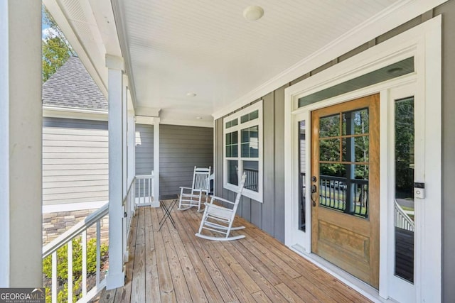 wooden terrace featuring covered porch