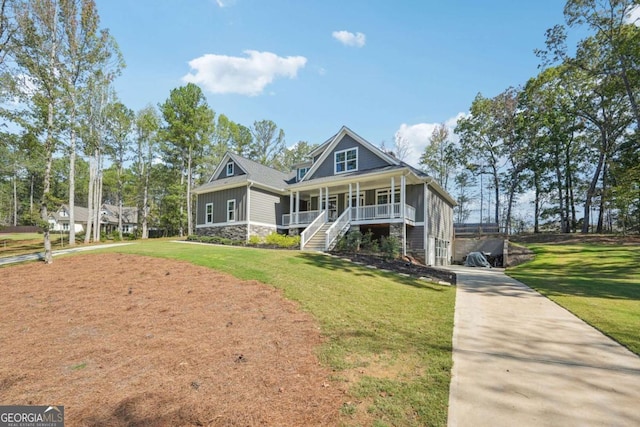 view of front of property with covered porch and a front yard