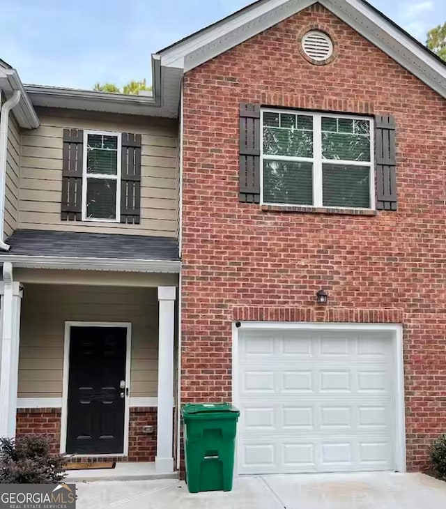 view of front of property with a garage