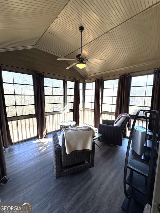 sunroom / solarium featuring lofted ceiling, ceiling fan, and wooden ceiling