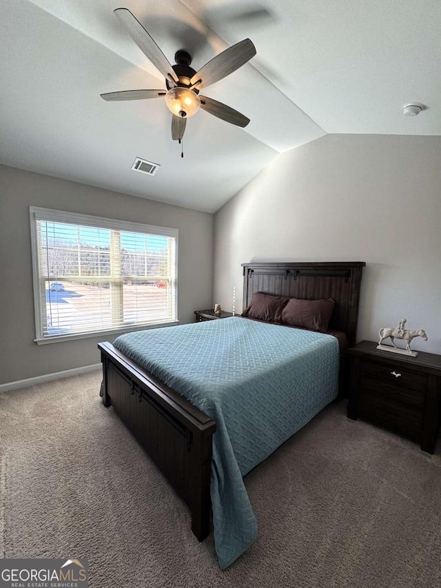 carpeted bedroom with ceiling fan and lofted ceiling