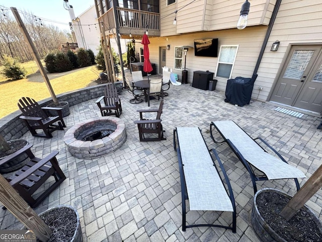 view of patio / terrace with a fire pit