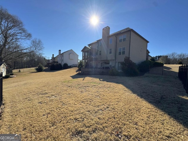 back of house with a yard